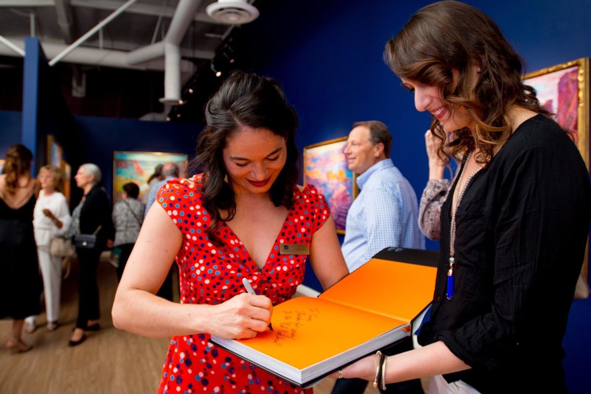 Erin signing her book