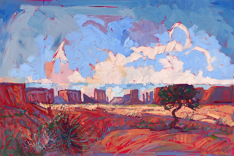 Oil painting of Arizona Monument Valley with red sandstone buttes standing on the horizon against the blue sky by artist Erin Hanson