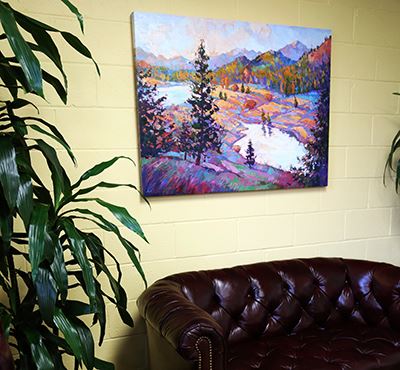 An Erin Hanson painting on display unframed