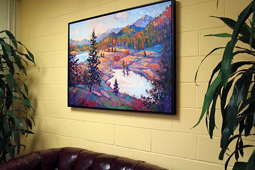 An Erin Hanson painting on display framed